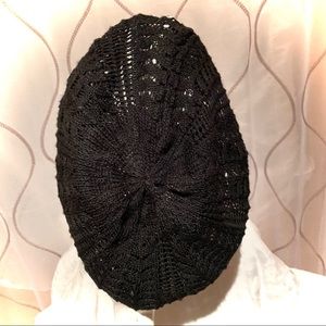 Knit black hat (with lace stitch pattern)